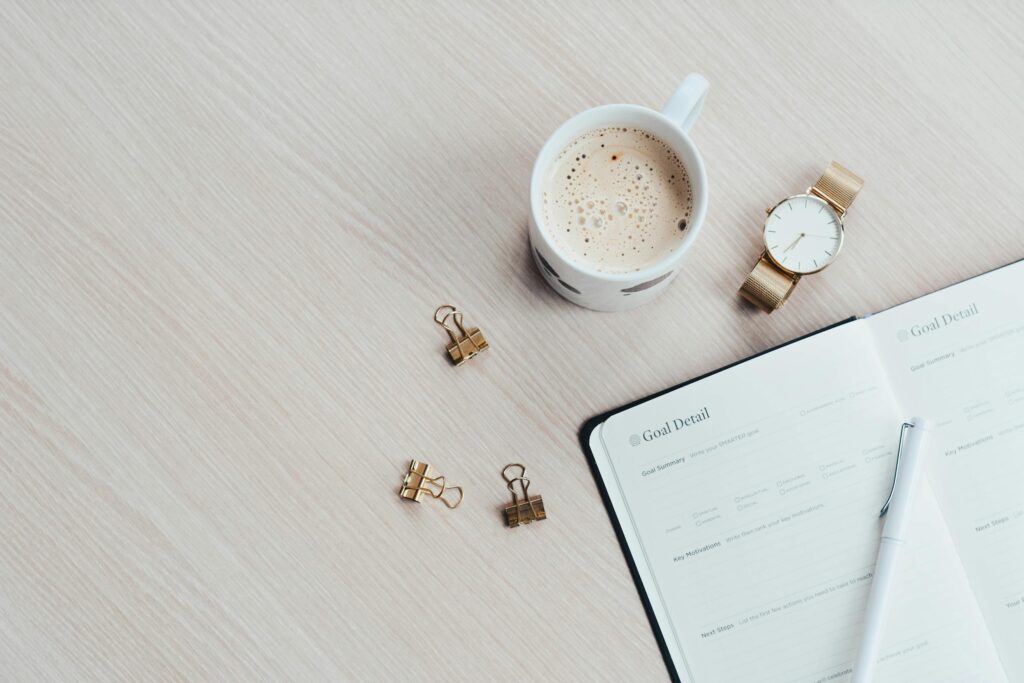 2026 planners and journals - image of 2026 planner with clips and coffee